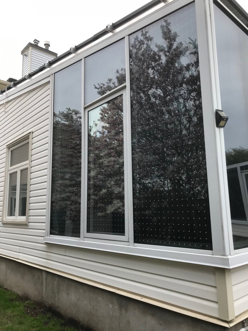 Feather Friendly® dotted window markers on side of house close up.